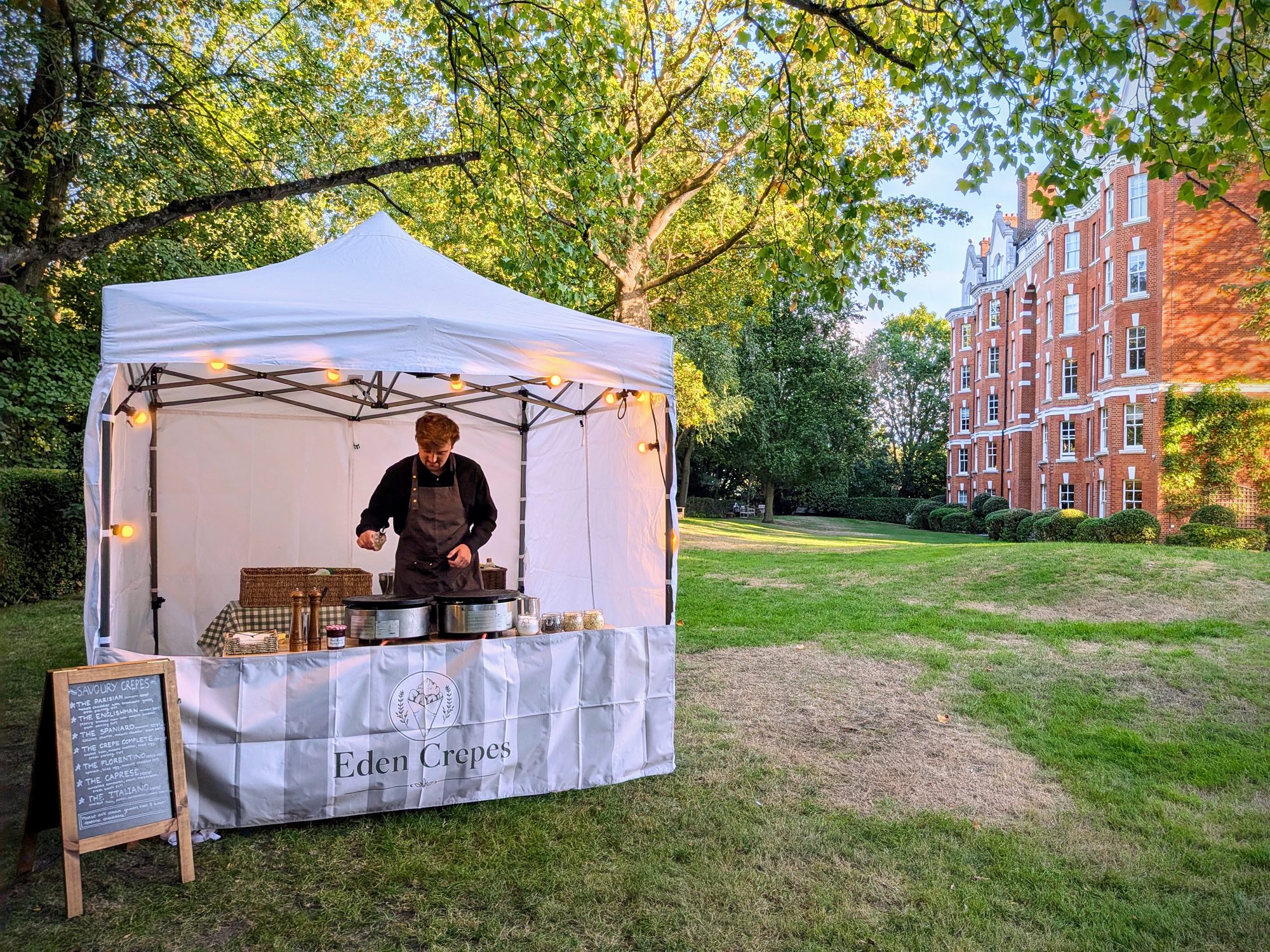 Eden Crepes branded gazebo crepe stall in a London garden